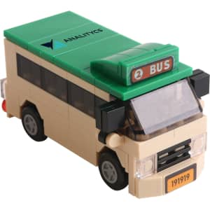A building block model of a beige bus with a green roof and a green "BUS" sign on top, featuring a logo.