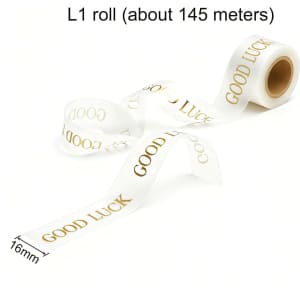 A roll of clear soft ribbon with gold text that reads "GOOD LUCK," measuring 16mm in width.