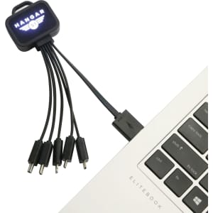 A square-shaped light-up charging cable featuring multiple connectors, in black, connected to a laptop.