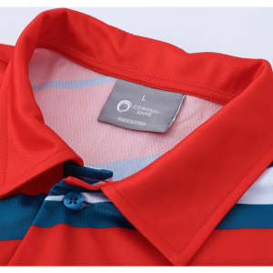 A red polo shirt with blue and white stripes, featuring buttons and a tag indicating size. It has a logo on the tag.