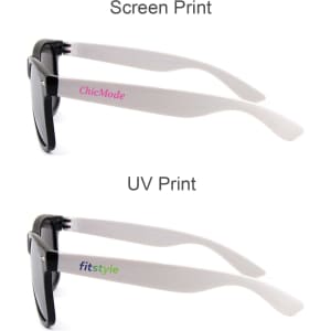 Stylish black sunglasses featuring white arms with printed branding. Includes two different print styles on the arms.