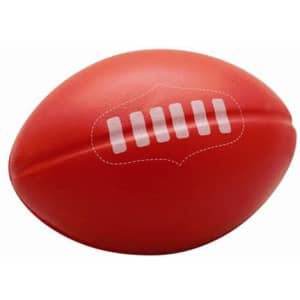 A red stress ball shaped like an Australian football, featuring white stitching details and a logo.