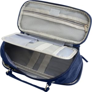 A pencil case in navy blue with compartments, a handle, and a zippered pocket, featuring a mesh organiser inside.