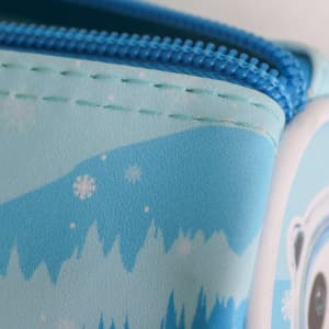 A blue PU leather pencil case featuring a snowy design and a zipper closure. It has a logo on the side.