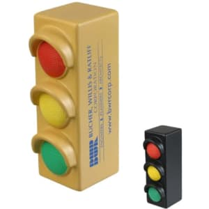 A traffic light-shaped stress reliever in yellow, featuring red, yellow, and green bulb designs. Includes a smaller black traffic light.