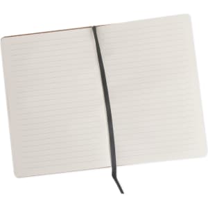 An A5 cork notebook with lined pages, featuring a black ribbon bookmark and a plain cork cover.