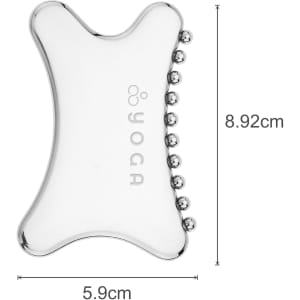 A transparent Gua Sha tool in a unique shape, featuring small rounded edges and a branding logo.