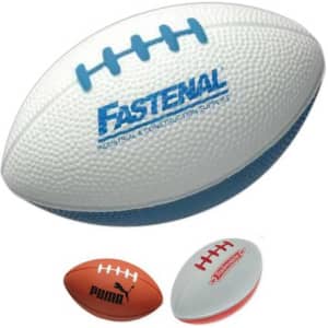 A rugby shape stress reliever in white with blue accents, featuring a logo, alongside two other stress balls.