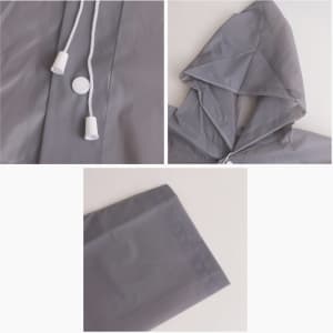 A grey reusable PEVA raincoat featuring a hood, drawstring, and cuff details. It includes a logo on the fabric.