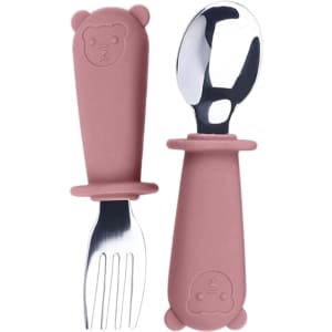 A set of kids' cutlery in pink, featuring a silicone bear-shaped handle with stainless steel fork and spoon.