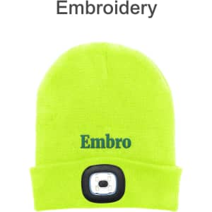 A bright yellow beanie featuring a built-in headlamp and a logo, designed for warmth and visibility.