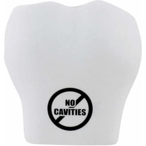 A white stress reliever shaped like a tooth, featuring a logo with a crossed-out symbol and the text "NO CAVITIES".