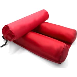 An inflatable floating chair in bright red, featuring two cylindrical sections with a securing strap.