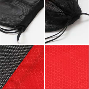 A drawstring mesh backpack in black with red hexagon-patterned sections, featuring a pull tie closure.