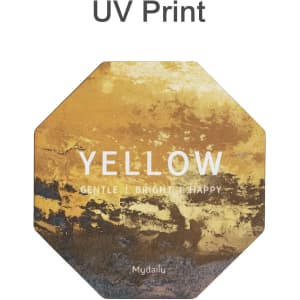 An octagonal frosted metal coaster in shades of yellow with a branded logo. Features a textured, artistic design.