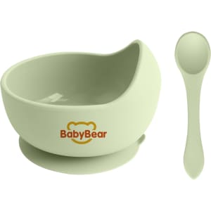 A pale green silicone kids suction bowl with a matching spoon, featuring a logo.