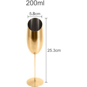 A stainless steel slanted champagne flute in a shiny gold finish, measuring 25.3 cm tall and 5.8 cm wide.