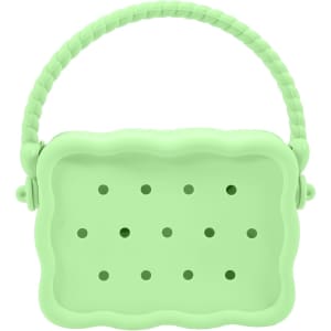 A green silicone bag with holes and a textured handle, featuring a scalloped design.
