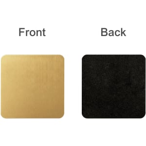 A square metal coaster in gold on one side and black on the other, featuring a logo.