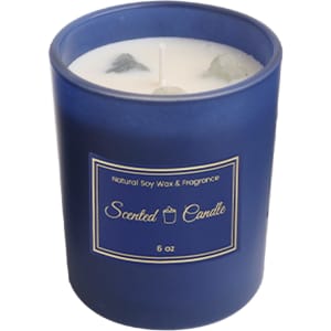 A blue glass candle with a white wax interior, featuring two wicks and a simple label.