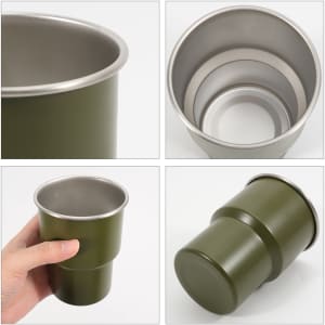 A green stainless steel camping mug, featuring an inner stainless steel lining and a sturdy base, complete with a logo.
