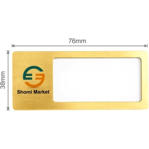 A reusable metal name badge in gold with a clear window and a logo. Dimensions are 76mm by 38mm.