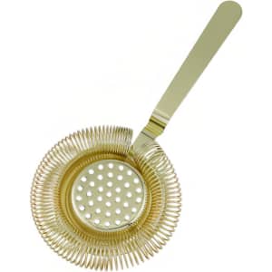 A round cocktail strainer in gold with a coiled handle and perforated base. It has a sleek, shiny finish.