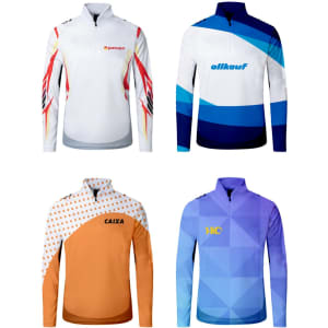 Four men's 1/4 zip fishing pullovers in various colours: white with red, blue with white, orange with polka dots, and purple. Each has a logo.