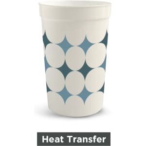 A plastic stadium cup in white featuring a pattern of blue and teal shapes. The cup has a logo.
