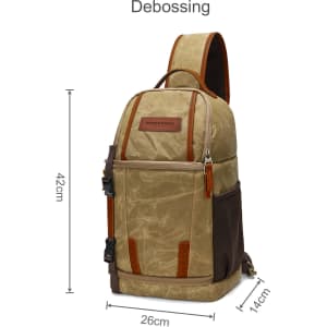 A waxed canvas camera sling bag in tan with brown and black accents, featuring various compartments and a logo.