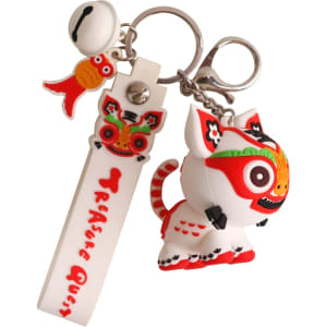 A custom-shaped PVC keyring featuring a colourful lion design with red and white accents, along with a fish charm.