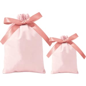 Two pink ribbon drawstring gift bags, one large and one small, tied with satin ribbons.