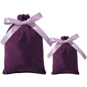 A set of purple velvet drawstring gift bags with matching satin ribbons, in two different sizes.