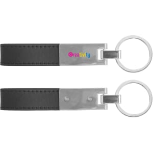 A black PU leather keyring with metal accents and a logo, featuring a sleek, minimalist design.