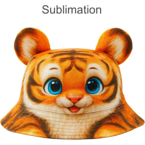 A bucket hat with a vibrant tiger face design, featuring oversized ears and bright blue eyes. It has a logo on it.