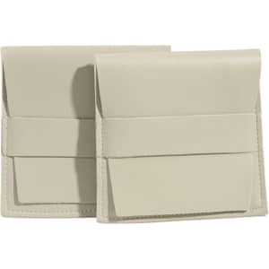 A duo of beige PU leather flip jewelry pouches with a sleek design and a simple strap closure.