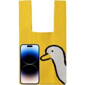 A yellow knitted handbag featuring a duck design and a smartphone alongside. The bag has a logo on it.