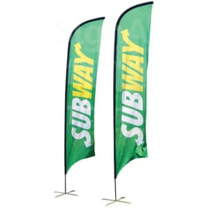 Two large concave feather banners, featuring a green colour with yellow text, standing upright on metal bases.