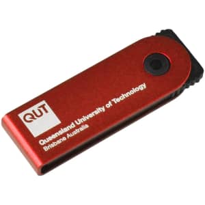 A red flash drive with a black end and a logo, featuring a compact design for portability.