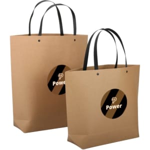 A medium brown paper bag with black handles and a circular logo in the centre.