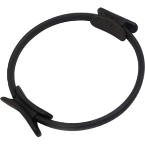 A black Pilates circle with a textured grip and flexible design, featuring a central stabilising clip.