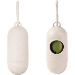 An eco-friendly white capsule-shaped pet waste bag dispenser with a visible compartment for bags and a hanging loop.