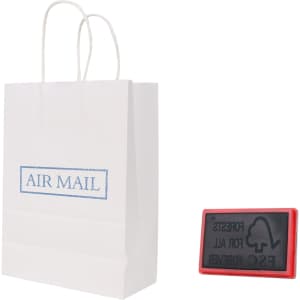 A white kraft paper bag with twisted handles beside a red rubber stamp. The bag features a branding logo.