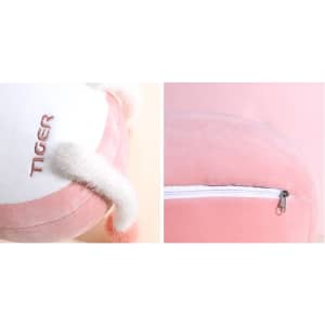 A plush, tiger-shaped travel pillow in pink and white, featuring small ears and a zippered section.