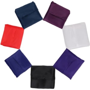 A circular arrangement of reusable foldaway shopping bags in navy, red, purple, black, and white. Each bag is folded neatly.