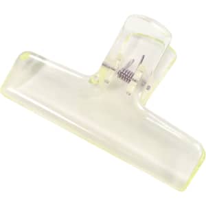 A translucent yellow plastic clip with a spring mechanism for securing items. It has a simple, modern design.