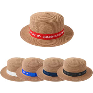A straw hat in brown with a ribbon band, available in multiple designs and colours including red, white, blue, and black.