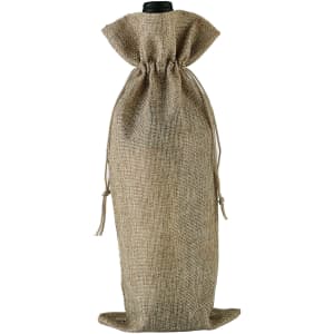 A wine drawstring bag in a natural beige colour, featuring a tied closure at the top and a simple design.