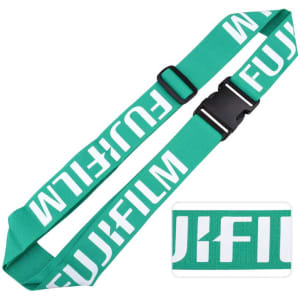 A teal luggage belt featuring a logo, designed with adjustable straps and a sturdy buckle.