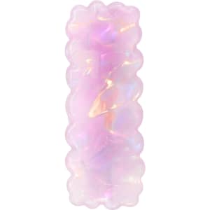 A wavy rectangle hair clip in iridescent pink with a glossy finish, featuring a subtle shimmer.